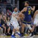 Charlotte Hornets guard Vasilije Micic, left, passes the ball while defended by Golden State Warriors guard Stephen Curry (30) during the first half of an NBA basketball game Friday, Feb. 23, 2024, in San Francisco. (AP Photo/Godofredo A. Vásquez)