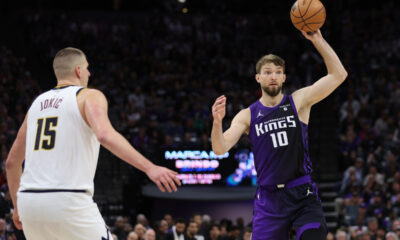 Sacramento Kings forward Domantas Sabonis (10) passes the ball as Denver Nuggets center Nikola Jokic (15) defends during the second half of an NBA basketball game in Sacramento, Calif, Friday, Feb. 9, 2024. (AP Photo/Jed Jacobsohn)