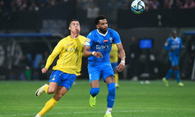Al Nassr's Cristiano Ronaldo, left, fights for the ball with Al Hilal's Al Bulayhi during Riyadh Season Cup 2024 final match at Kingdom Arena Stadium in Riyadh, Saudi Arabia, Thursday, Feb. 8, 2024. (AP Photo)