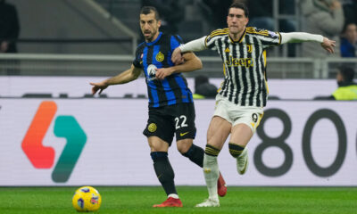 Inter Milan's Henrikh Mkhitaryan, left, and Juventus' Dusan Vlahovic fight for the ball during a Serie A soccer match between Inter Milan and Juventus, in Milan, Italy, Sunday, Feb. 4, 2024. (AP Photo/Antonio Calanni)