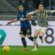 Inter Milan's Henrikh Mkhitaryan, left, and Juventus' Dusan Vlahovic fight for the ball during a Serie A soccer match between Inter Milan and Juventus, in Milan, Italy, Sunday, Feb. 4, 2024. (AP Photo/Antonio Calanni)