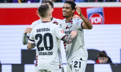 Leverkusen's Amine Adli, right, celebrates after scoring his side's second goal during the Bundesliga soccer match between 1. FC Heidenheim and Bayer 04 Leverkusen in Heidenheim, Germany, Saturday, Feb. 17, 2024. (Tom Weller/dpa via AP)
