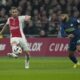 Ajax's Jordan Henderson, left, and PSV's Ismael Saibari, right, vie for the ball during the Dutch Eredivisie soccer match between Ajax and PSV at ArenA stadium Amsterdam, Netherlands, Saturday, Feb. 3, 2024. (AP Photo/Peter Dejong)