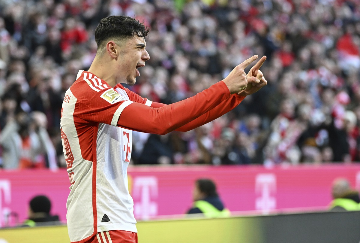 Bayern Munich's Aleksandar Pavlovic celebrates scoring his side's opening goal during the German Bundesliga soccer match between Bayern Munich and Borussia Moenchengladbach, at the Allianz Arena in Munich, Germany, Saturday, Feb. 3, 2024. (Angelika Warmuth/dpa via AP)