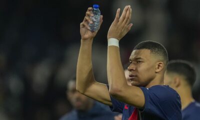 PSG's Kylian Mbappe celebrates at the end of the Champions League round of 16 first leg soccer match between Paris Saint-Germain and Real Sociedad, at the Parc des Princes stadium in Paris, France, Wednesday, Feb. 14, 2024. (AP Photo/Christophe Ena)