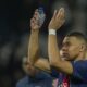 PSG's Kylian Mbappe celebrates at the end of the Champions League round of 16 first leg soccer match between Paris Saint-Germain and Real Sociedad, at the Parc des Princes stadium in Paris, France, Wednesday, Feb. 14, 2024. (AP Photo/Christophe Ena)