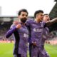 Liverpool's Mohamed Salah celebrates scoring his sides third goal during the English Premier League soccer match between Brentford and Liverpool at the Gtech Community Stadium in London, Saturday, Feb. 17, 2024. (AP Photo/Kirsty Wigglesworth)