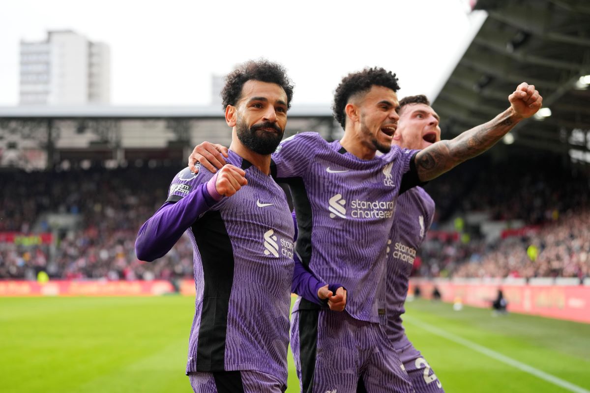 Liverpool's Mohamed Salah celebrates scoring his sides third goal during the English Premier League soccer match between Brentford and Liverpool at the Gtech Community Stadium in London, Saturday, Feb. 17, 2024. (AP Photo/Kirsty Wigglesworth)