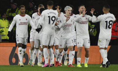 Manchester United's Marcus Rashford, left, celebrates with teammates after scoring his side's opening goal during the English Premier League soccer match between Wolverhampton Wanderers and Manchester United at the Molineux Stadium in Wolverhampton, England, Thursday, Feb. 1, 2024. (AP Photo/Rui Vieira)