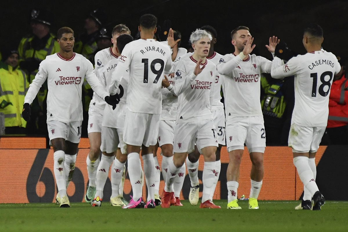 Manchester United's Marcus Rashford, left, celebrates with teammates after scoring his side's opening goal during the English Premier League soccer match between Wolverhampton Wanderers and Manchester United at the Molineux Stadium in Wolverhampton, England, Thursday, Feb. 1, 2024. (AP Photo/Rui Vieira)