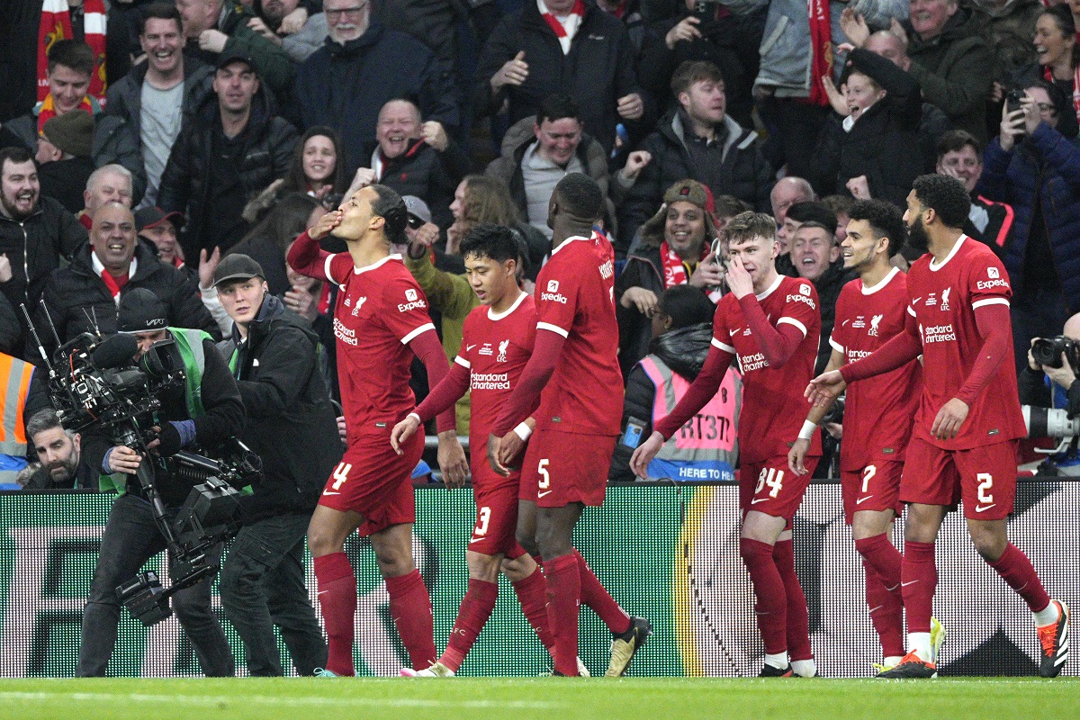Liverpool's Virgil van Dijk, left, celebrates scoring a goal that was disallowed during the English League Cup final soccer match between Chelsea and Liverpool at Wembley Stadium in London, Sunday, Feb. 25, 2024.(AP Photo/Dave Shopland)