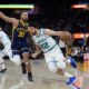 Charlotte Hornets guard Vasilije Micic (22) tries to get around Golden State Warriors guard Stephen Curry (30) during the second half of an NBA basketball game, Friday, Feb. 23, 2024, in San Francisco. (AP Photo/Godofredo A. Vásquez)