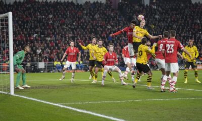 Dortmund's Nico Schlotterbeck, top right, out jumps PSV's Malik Tillman, top left, to head the ball during the Champions League round of 16 first leg soccer match between PSV Eindhoven and Borussia Dortmund at Philips stadium in Eindhoven, Netherlands, Tuesday, Feb. 20, 2024. (AP Photo/Peter Dejong)