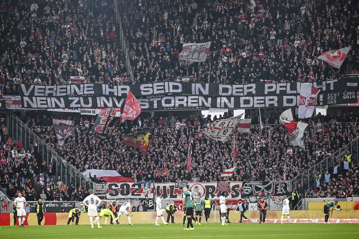 VfB Stuttgart fans hold a banner reading ''Clubs You have a duty - No to investors in the DFL'' during the Bundesliga soccer match between SC Freiburg and VfB Stuttgart at the Europa-Park Stadium in Freiburg im Breisgau, Germany, Saturday Feb. 3, 2024. (Harry Langer/dpa via AP)