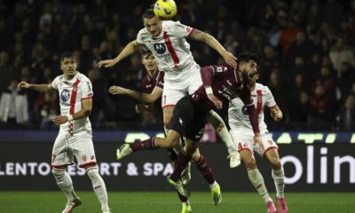 Salernitana's Triantafyllos Pasalidis and Monza's Milan Djuric, top, fight for the ball during the Serie A soccer match between Salernitana and Monza at the Stadio Arechi in Salerno, Italy, Saturday Feb. 24, 2024. ;(Alessandro Garofalo/LaPresse via AP)