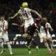Salernitana's Triantafyllos Pasalidis and Monza's Milan Djuric, top, fight for the ball during the Serie A soccer match between Salernitana and Monza at the Stadio Arechi in Salerno, Italy, Saturday Feb. 24, 2024. ;(Alessandro Garofalo/LaPresse via AP)