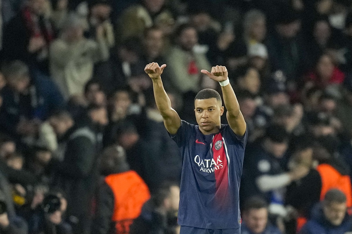 PSG's Kylian Mbappe celebrates after scoring his side's opening goal during the Champions League round of 16 first leg soccer match between Paris Saint-Germain and Real Sociedad, at the Parc des Princes stadium in Paris, France, Wednesday, Feb. 14, 2024. (AP Photo/Christophe Ena)