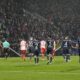 Both teams leave the pitch when the referee interrupted the match because of tennis balls on the pitch, thrown by fans as a protest against investors in the Bundesliga during the German Bundesliga soccer match between VfL Bochum and FC Bayern Munich in Bochum, Germany, Sunday, Feb. 18, 2024. (AP Photo/Martin Meissner)