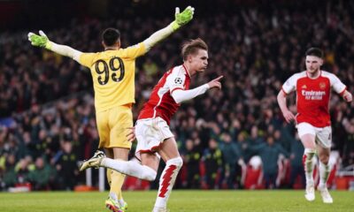 Arsenal's Martin Odegaard, center, celebrates scoring before his goal is then disallowed during the Champions League round of 16, second leg soccer match between Arsenal and Porto at the Emirates Stadium, London, Tuesday March 12, 2024. (Zac Goodwin/PA via AP)