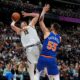 Denver Nuggets center Nikola Jokic (15) is fouled while going up for a basket by New York Knicks center Isaiah Hartenstein (55) in the second half of an NBA basketball game Thursday, March 21, 2024, in Denver. (AP Photo/David Zalubowski)