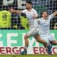 Saarbrucken's Kai Brunker, left, celebrates scoring during the German Cup quarterfinal soccer match between FC Saarbrucken and Borussia Monchengladbach at Ludwigspark Stadium, Saarbrucken, Germany, Tuesday March 12, 2024. (Uwe Anspach/dpa via AP)