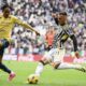 Genoa's Djed Spence, left, challenges Juventus' Filip Kostic during the Italian Serie A soccer match between Juventus and Genoa at the Allianz Stadium in Turin, Italy, Sunday, March 17, 2024. (Marco Alpozzi/LaPresse via AP)