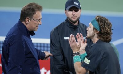 ATP Supervisor Roland Herfel, left, disqualifies Andrey Rublev during his semi final match with Alexander Bublik of Kazakhstan at the Dubai Duty Free Tennis Championships in Dubai, United Arab Emirates, Friday, March 1, 2024. (AP Photo/Kamran Jebreili)