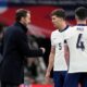England coach Gareth Southgate speaks to England's John Stones during a friendly soccer match between England and Brazil at Wembley Stadium in London, Saturday, March 23, 2024. (AP Photo/Alastair Grant)