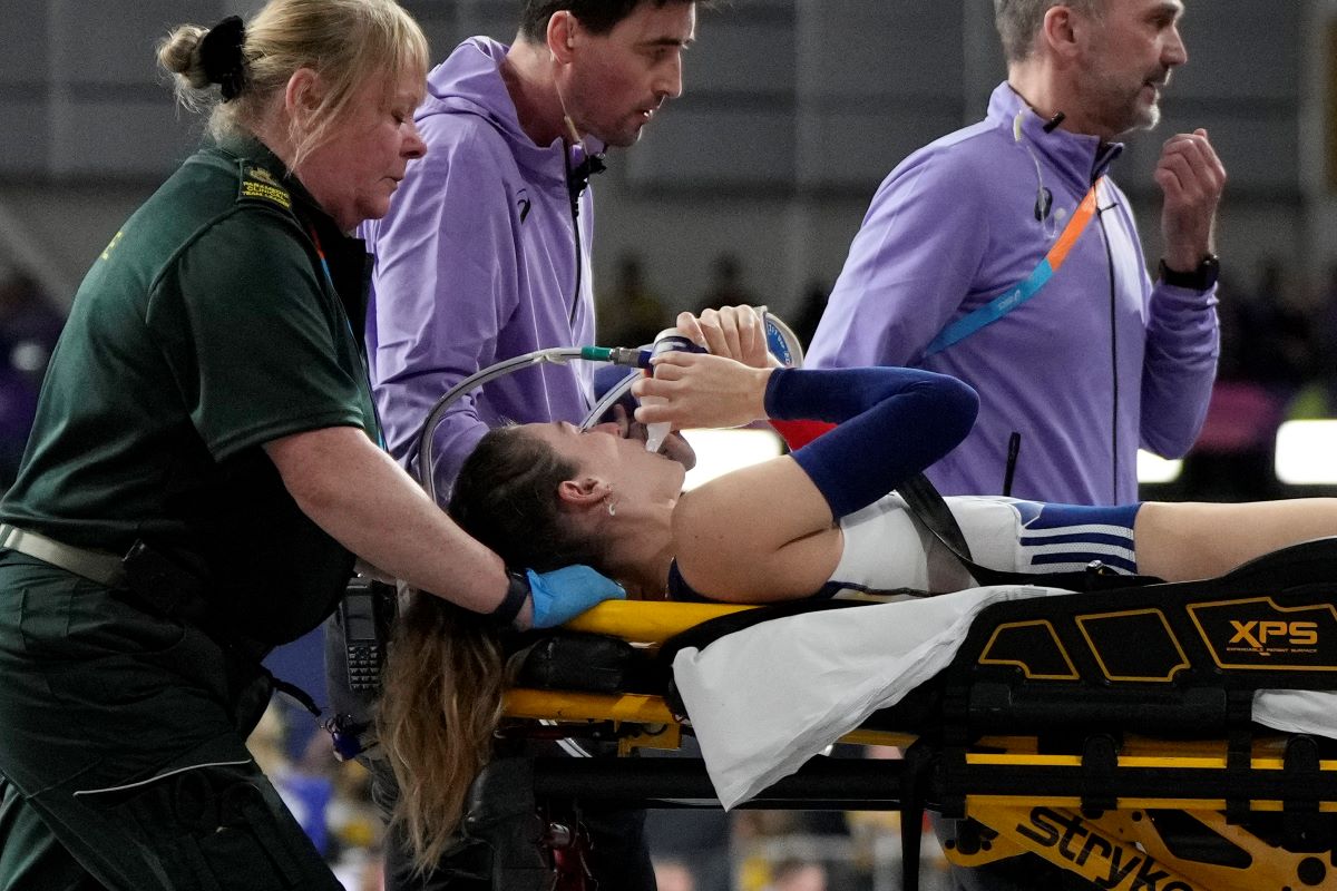 Margot Chevrier, of France, is carried on a stretcher after getting injured in the women's pole vault during the World Athletics Indoor Championships at the Emirates Arena in Glasgow, Scotland, Saturday, March 2, 2024. (AP Photo/Bernat Armangue)