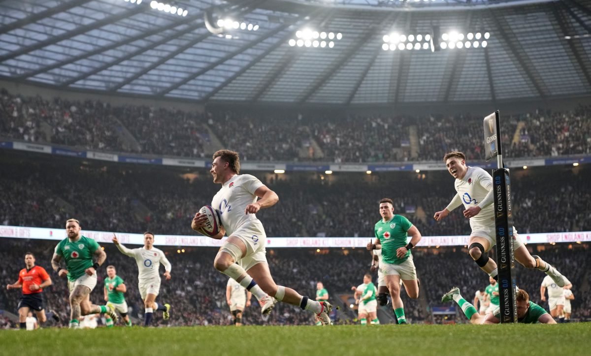England's George Furbank crosses the line to score a try during the Six Nations rugby union international match between England and Ireland at Twickenham stadium, London Saturday, March 9, 2024. (AP Photo/Alastair Grant)