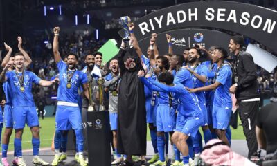 Al Hilal players celebrate the trophy of Riyadh Season Cup 2024 at Kingdom Arena Stadium in Riyadh, Saudi Arabia, on Feb. 8, 2024. Saudi Arabian soccer club Al Hilal will target a 28th straight win in competitive games Tuesday, March 12, 2024, that would set a world record for a top-tier team. Fueled by Serbia forward Aleksandar Mitrović’s goals during Neymar’s long-term injury, Al Hilal aims for the record-setting win in a second-leg game in the Asian Champions League quarterfinals against domestic rival Al Ittihad. (AP Photo)