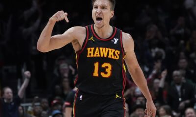 Atlanta Hawks guard Bogdan Bogdanovic (13) reacts after a basket during the second half of an NBA basketball game against the Boston Celtics Thursday, March 28, 2024, in Atlanta. (AP Photo/John Bazemore)