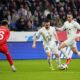 Serbia's Andrija Zivkovic, centre, and Serbia's Milan Gajic, right, in action against Russia's Daniil Khlusevich during an international friendly soccer match between Russia and Serbia at the Central Dynamo Stadium of Lev Yashin in Moscow, Russia, Thursday, March 21, 2024. (AP Photo/Alexander Zemlianichenko)