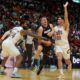 Cleveland Cavaliers forward Marcus Morris Sr. (24) and forward Georges Niang (20) defend Miami Heat forward Nikola Jovic (5) during the second half of an NBA basketball game, Sunday, March 24, 2024, in Miami. (AP Photo/Marta Lavandier)