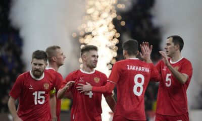Russia players celebrate after Russia's Ivan Sergeyev scored his side's fourth goal during an international friendly soccer match between Russia and Serbia at the Central Dynamo Stadium of Lev Yashin in Moscow, Russia, Thursday, March 21, 2024. (AP Photo/Alexander Zemlianichenko)