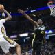 New Orleans Pelicans forward Brandon Ingram shoots against Indiana Pacers forward Jalen Smith (25) during the second half of an NBA basketball game Wednesday, Feb. 28, 2024, in Indianapolis. (AP Photo/Marc Lebryk)