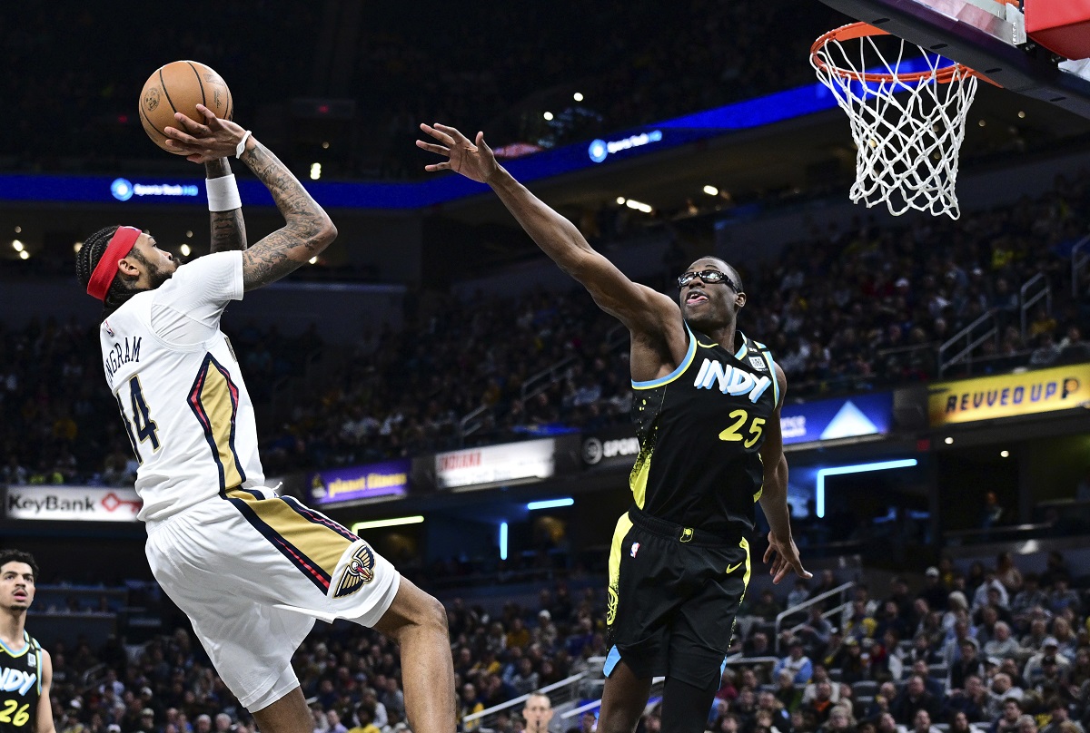 New Orleans Pelicans forward Brandon Ingram shoots against Indiana Pacers forward Jalen Smith (25) during the second half of an NBA basketball game Wednesday, Feb. 28, 2024, in Indianapolis. (AP Photo/Marc Lebryk)