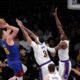 Denver Nuggets center Nikola Jokic, left, shoots as Los Angeles Lakers forward Anthony Davis, center, and forward Rui Hachimura defend during the first half of an NBA basketball game Saturday, March 2, 2024, in Los Angeles. (AP Photo/Mark J. Terrill)