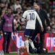 England coach Gareth Southgate speaks to England's Jude Bellingham as he leaves the pitch after being substituted during a friendly soccer match between England and Brazil at Wembley Stadium in London, Saturday, March 23, 2024. (AP Photo/Alastair Grant)