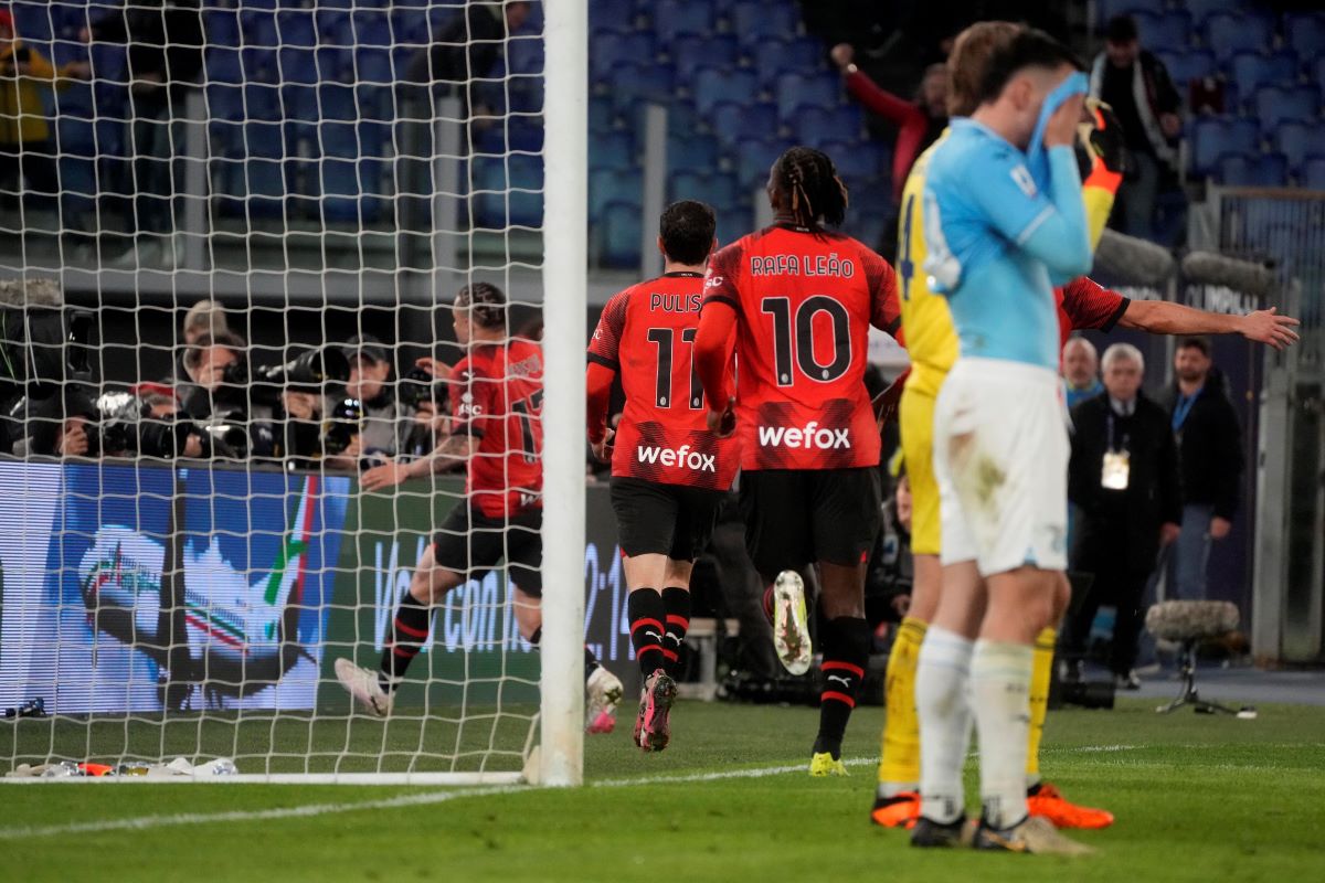 AC Milan's Noah Okafor celebrates with team mates after scoring his side's opening goal during the Italian Serie A soccer match between Lazio and Milan at Rome's Olympic stadium, Friday, March 1, 2024. (AP Photo/Gregorio Borgia)
