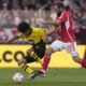 Dortmund's Karim Adeyemi, left, and Union's Lucas Tousart challenge for the ball during the German Bundesliga soccer match between 1. FC Union Berlin and Borussia Dortmund in Berlin, Germany, March 2, 2024. (AP Photo/Ebrahim Noroozi)