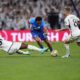 Leipzig's Lois Openda, centre, tries to dribble past Real Madrid's Aurelien Tchouameni, left, and Real Madrid's Toni Kroos during the Champions League round of 16 second leg soccer match between Real Madrid and RB Leipzig at the Santiago Bernabeu stadium in Madrid, Spain, Wednesday, March 6, 2024. (AP Photo/Manu Fernandez)
