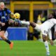 Inter Milan's Federico Dimarco vies for the ball with Napoli's Andre-Frank Zambo Anguissa, right, during the Serie A soccer match between Inter Milan and Napoli at the San Siro Stadium, in Milan, Italy, Sunday, March 17, 2024. (AP Photo/Antonio Calanni)