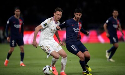 PSG's Marco Asensio, right, challenges Lyon's Nemanja Matic during the French League One soccer match between Paris Saint-Germain and Lyon at the Parc des Princes stadium in Paris, Sunday, April 21, 2024. (AP Photo/Christophe Ena)