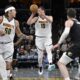 Denver Nuggets center Nikola Jokic (15) handles the ball in the second half of an NBA basketball game against the Memphis Grizzlies Sunday, April 14, 2024, in Memphis, Tenn. (AP Photo/Brandon Dill)