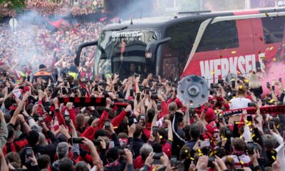 The team bus of Bayer Leverkusen is welcomed by thousands of supporters at the stadium ahead of the German Bundesliga soccer match between Bayer Leverkusen and Werder Bremen in Leverkusen, Germany, Sunday, April 14, 2024. Leverkusen could win the Bundesliga title if they win the match against Bremen.(AP Photo/Martin Meissner)