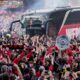 The team bus of Bayer Leverkusen is welcomed by thousands of supporters at the stadium ahead of the German Bundesliga soccer match between Bayer Leverkusen and Werder Bremen in Leverkusen, Germany, Sunday, April 14, 2024. Leverkusen could win the Bundesliga title if they win the match against Bremen.(AP Photo/Martin Meissner)