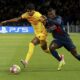 Barcelona's Lamine Yamal fights for the ball with PSG's Nuno Mendes during the Champions League quarterfinal first leg soccer match between Paris Saint-Germain and Barcelona at the Parc des Princes stadium in Paris, Wednesday, April 10, 2024. (AP Photo/Aurelien Morissard)