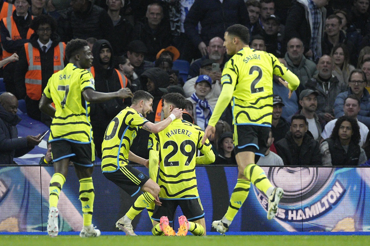 Arsenal's Kai Havertz, centre, celebrates with teammates after scoring his side's second goal during the English Premier League soccer match between Brighton and Hove Albion and Arsenal at the American Express Community Stadium in Brighton, England, Saturday, April 6, 2024. (AP Photo/Dave Shopland)