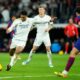 Real Madrid's Jude Bellingham shoots the ball during the Spanish La Liga soccer match between Real Madrid and Barcelona at the Santiago Bernabeu stadium in Madrid, Spain, Sunday, April 21, 2024. (AP Photo/Jose Breton)